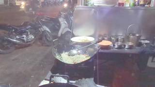 People enjoying tasty fried rice Chinese street food