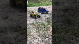 Yellow Traxxas trx4 sport and blue defender Trx4