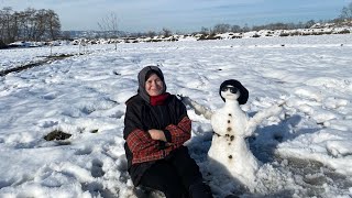 Trapping an ornamental and expensive bird in the snow/making a handsome snowman/hunting/village/snow