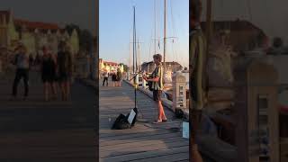 Busker plays Tennessee Whiskey by a harbour at sunset #shorts