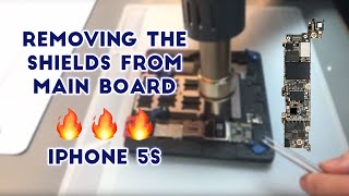 Watch The Spark Angels remove the main shields from the board of an iPhone 5S