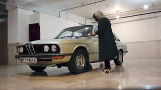 Girl Cleaning the BMW E12 518 1977 Reseda Green