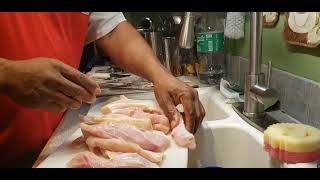 Cooking Buffalo fish Ribs .Trimming the red meat off.