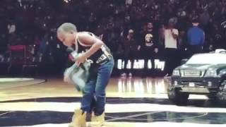 KID PERFORMS CHILDS PLAY WITH DRAKE AT TORONTO RAPTORS GAME.