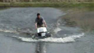 Snowmobile water cross pond 3