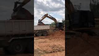 An excavator loads the soil into the truck#short #excavator