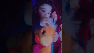 baby playing with orange duck 🦆