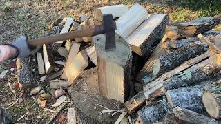 Basic splitting large rounds of wood. In this case Ash.