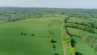 Drone shot over a vast green region of wales, united kingdom FREE STOCK VIDEO