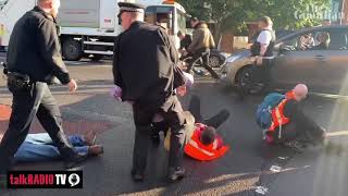 Motorists and paramedic crew drag away Insulate "Britain protesters" on Wandsworth Bridge