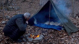 Campfire cooking. In the forest with Polish lavvu.