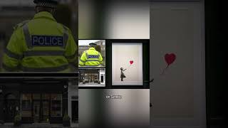 Two charged after famous Banksy painting stolen from London gallery