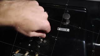 Power switch tumbler being turned on and off by male hand. Media. Close up of a machine control