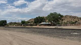 Amtrak #4 passes through Los Cerrillos, NM, at 3:05pm, June 25, 2021, with 2 extra cars on the rear.