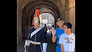 King's Guard shows respect to a boy with autism