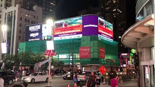 Demand full labour rights and immigration #StatusForAll billboard in Dundas Square Toronto