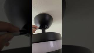 DIY home improvement using a sharpie to blend in colored wire on a new ceiling fan installation