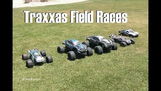 5 Traxxas Trucks Racing In The Field