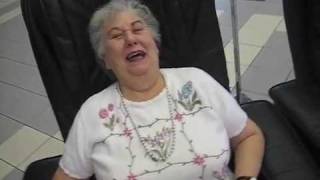 Grandma rides the mall massage chair