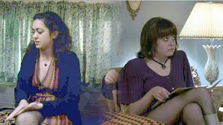 Some off duty prostitutes in fishnets & pantyhose sitting on a couch.  s02e03 HBO series The Deuce