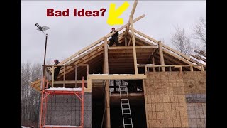 Installing Very Heavy Rafters While Slipping On Ice. 25 Feet High. Post And Beam Building.