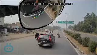 The biker had a close call with a truck