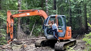 Cabin on a cliff (Chapter 4) - Seeking logs, hauling material and more foundation work.