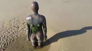 Weird statues on the beach in Liverpool and Radio City Tower