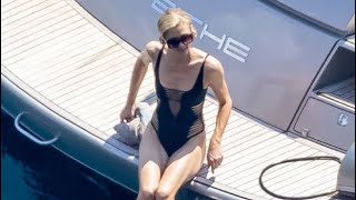 Paris Hilton Rocks Sexy Black Swimsuit As She Straddles Husband Carter Reum In Italy