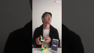 Man trying to solve a Rubik's Cube blindly, but in a different way