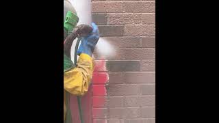 Sandblasting paint removal from brickwork