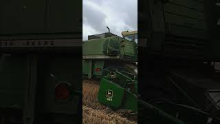 Combining wheat with 7700 John Deere Combine