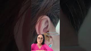 Dr.Natacha, big earwax removal earclining.