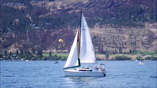 ONE MINUTE of a SAILBOAT SAILING on OKANAGAN LAKE near Kelowna, BC, Canada