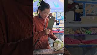 Young lady cutting coconut fruit. #streetfood #coconut #shorts #satisfying #short