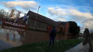 Man with mobility scooter gets through the floods (and cycles, cars). Hereford 03/01/2024.