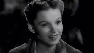 Judy Garland- a pretty girl milking her Cow