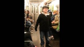 Atchison Topeka and the Santa Fe  and Holly Jolly Christmas  on the NYC subway. Christmas 2014