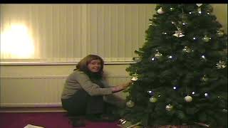 Carolann dresses our first Christmas Tree while Benjie tucks into his Thomas Advent Calendar 2002