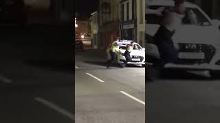 Man almost gets away after pissing on a police car, the keyword here is almost