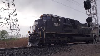 NS 1073 "Penn Central" leads NS 123 through West Chester Ohio and, gives a horn salute plus a wave!