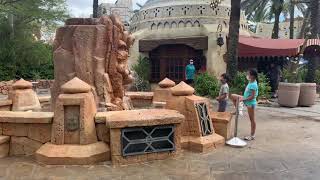 Kids talking to the fountain at Universal Studios Orlando