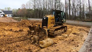 DEALING WITH SOME BAD CONDITIONS WHILE TRYING TO GET THIS POND ON GRADE