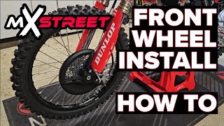 How to Remove and Install the Front Wheel on a Motocross Bike