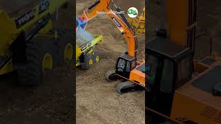 SANY hydraulic RC excavator loading a hydraulic RC dump truck at Cabin Fever Expo