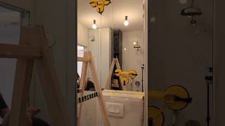 We glue 3 mirrors panel to the wall in the bathroom.  It is important that the mirrors stand exactly