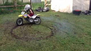 6 year old doing doughnuts on Suzuki jr50