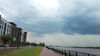 Walking on Goldsborough Drive along an inlet of Upper New York Bay in Bayonne, New Jersey, USA