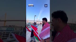 Iraqi elderly man kisses the Jordanian flag