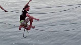 Monastyrsky Island. Equilibrists-tightrope walkers over water.